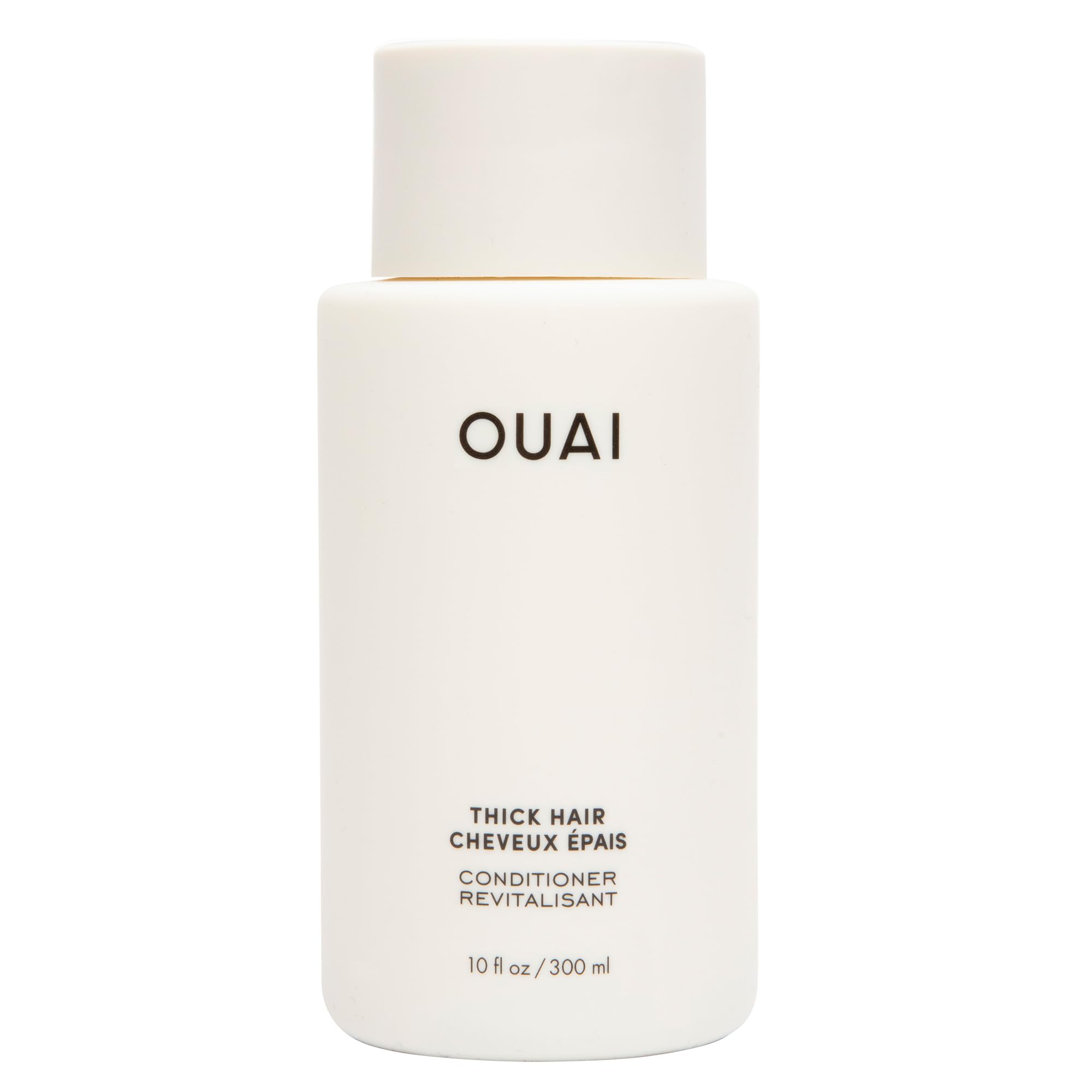 OUAI Thick Hair Conditioner bottle pour showing rich hydration for smooth strands