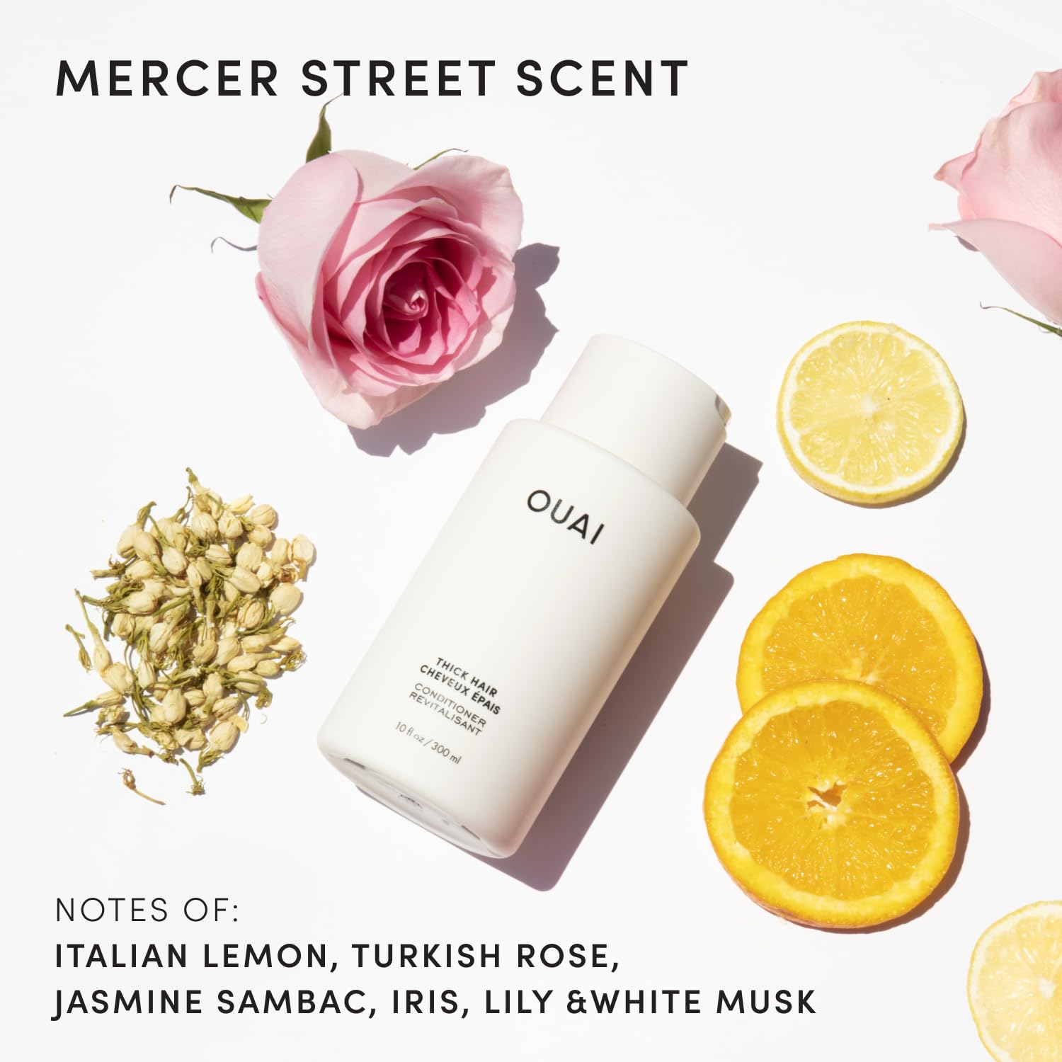 OUAI Thick Hair Conditioner being applied to hair after shower for detangling ease