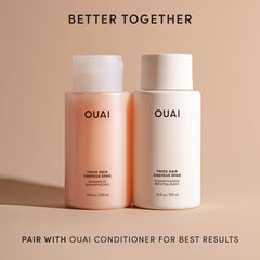 OUAI Thick Shampoo lather close up showing creamy foam for frizz control