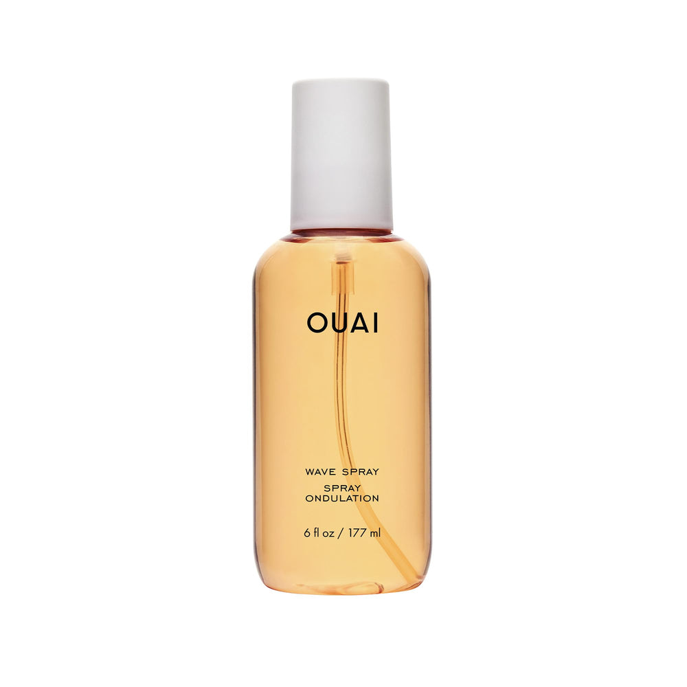 OUAI Wave Spray bottle close-up showing texture and shine for hair styling
