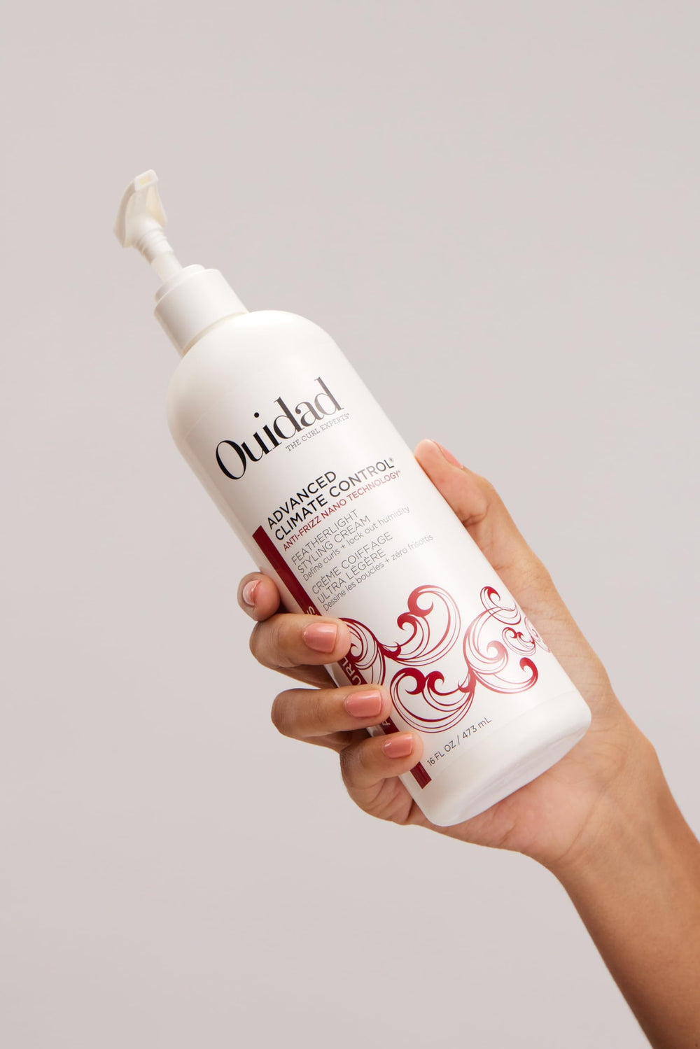 Ouidad Advanced Climate Control anti-frizz nano technology—blocks humidity for lasting control.