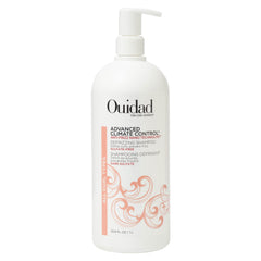 Ouidad Advanced Climate Control Defrizzing Shampoo bottle demonstrates frizz prevention for all curl types.