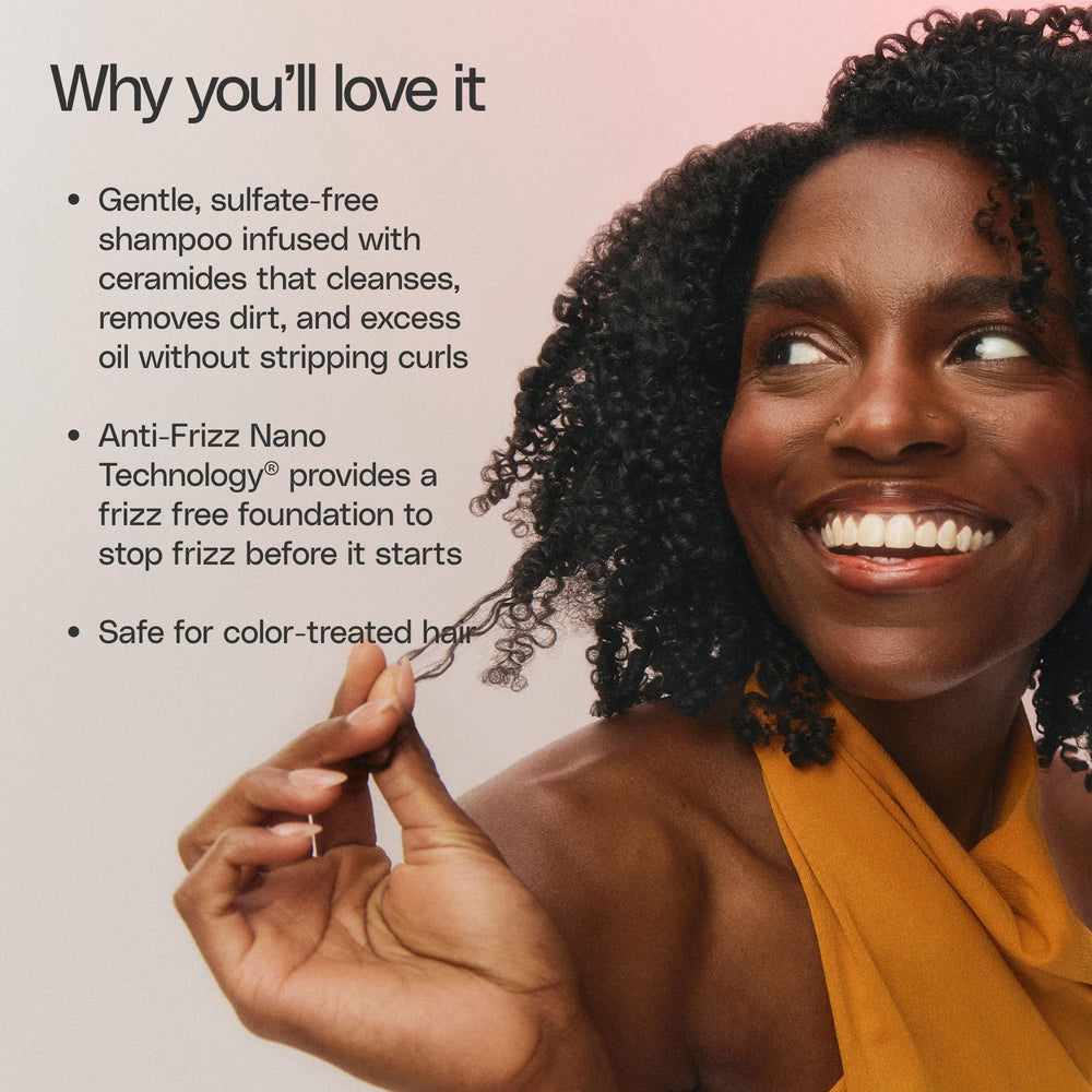 Ouidad application from mid lengths to ends with a wide-tooth comb.