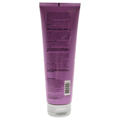 Ouidad Coil Infusion hair definition shot showing smooth, elongated coil texture.