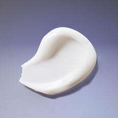 Close-up of ingredients on Ouidad Curl Quencher bottle highlights chamomile and vitamins.