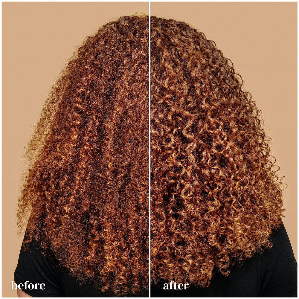 Ouidad Curl Quencher moisture-glow bottle close-up highlights hydration and softness.