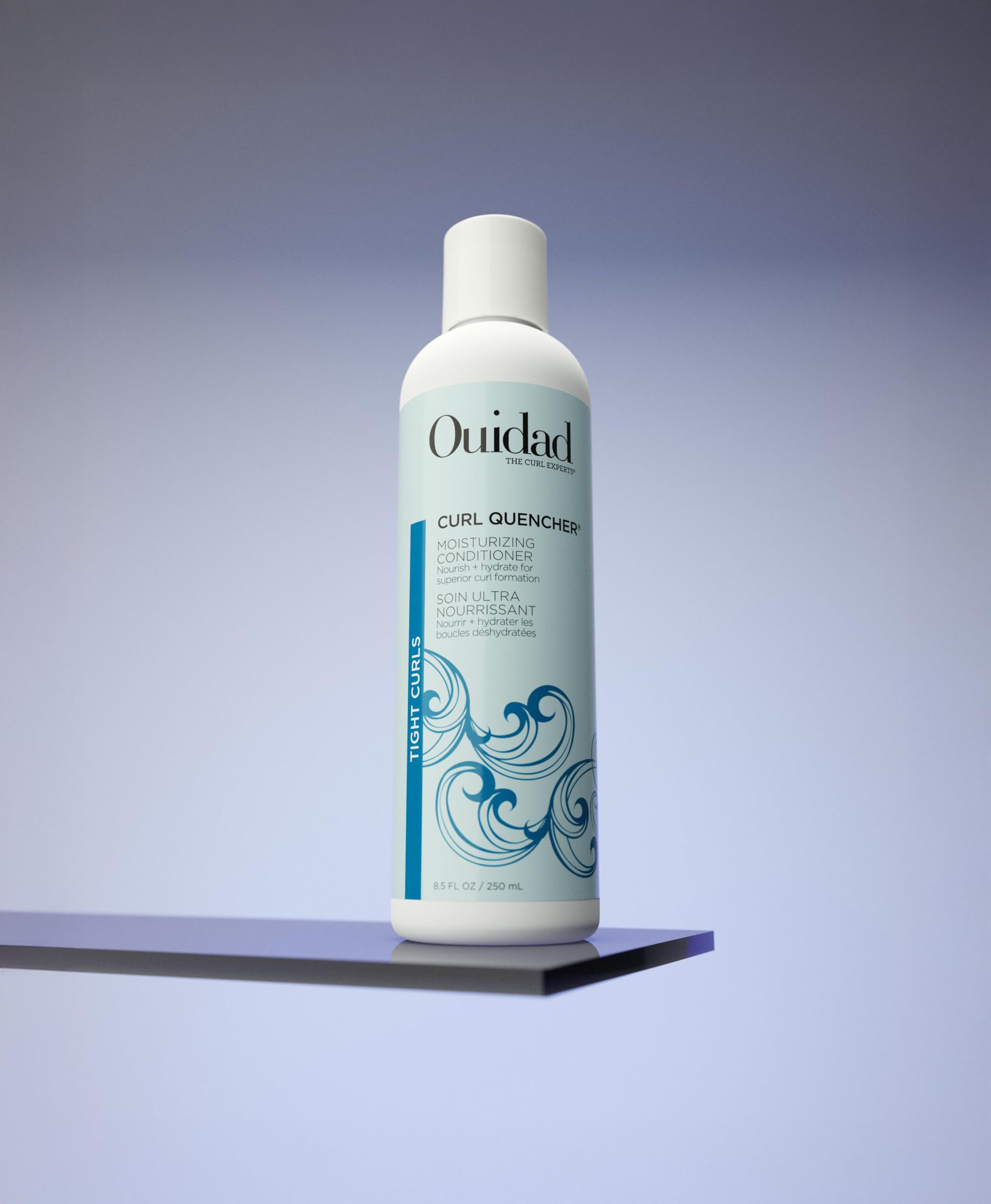 Ouidad Curl Quencher texture close-up shows creamy conditioner for detangling