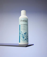 Ouidad Curl Quencher texture close-up shows creamy conditioner for detangling