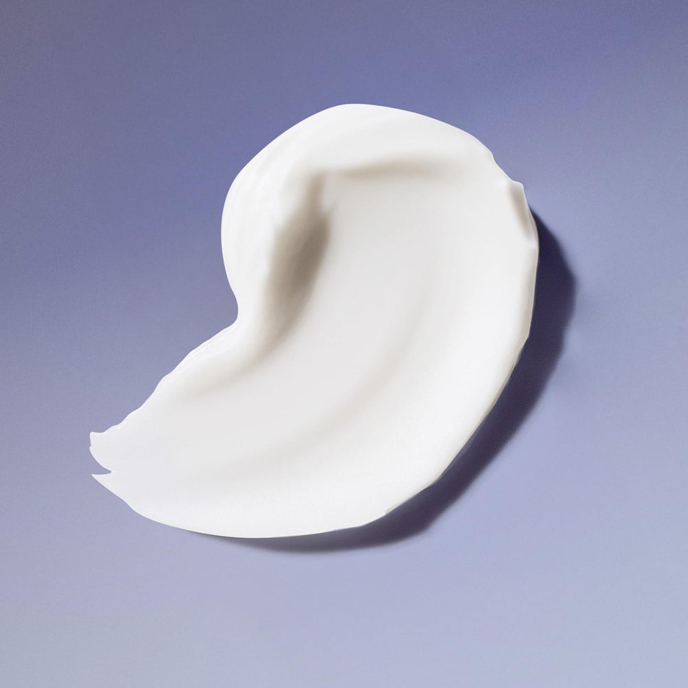 Ouidad Curl Quencher texture close-up reveals creamy formula without weighing down.