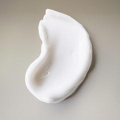 Ouidad Curl Shaper bottle delivering weightless moisture to curls