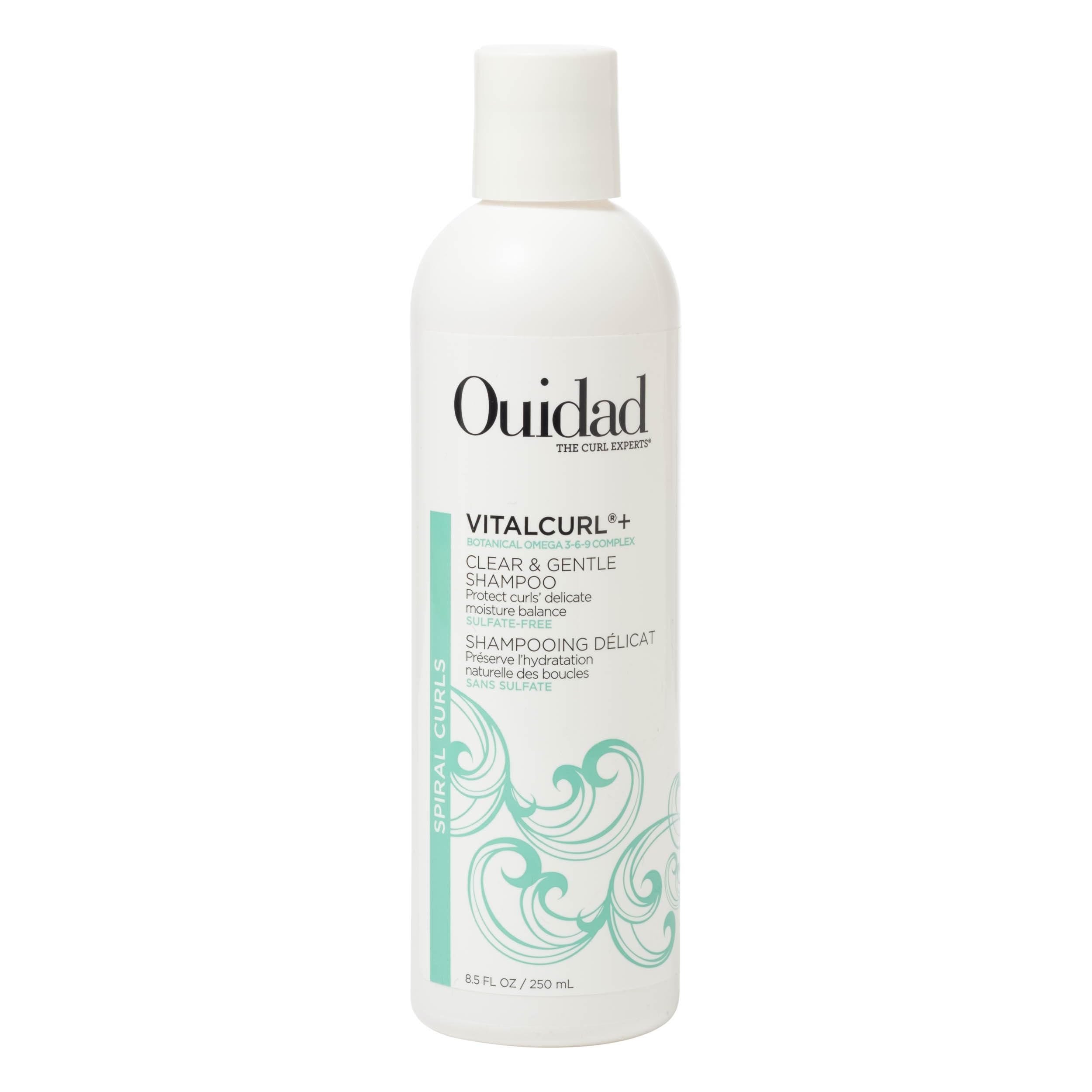 Ouidad VitalCurl+ muestra la botella vertido para limpieza suave y humedad.