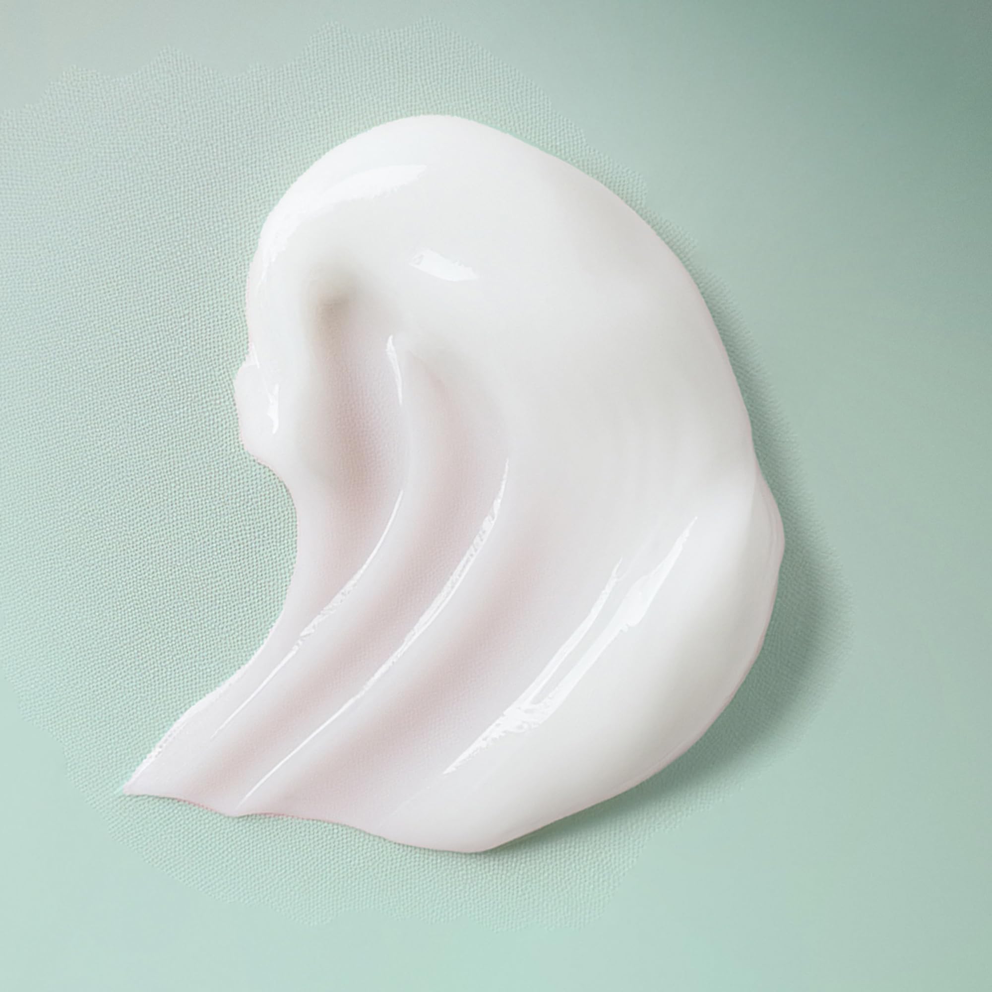 Ouidad VitalCurl+ Define & Shine bottle label detail emphasizes botanical omega complex.