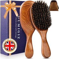OUMIGIZ boar bristle brush with back-sculpted design for comfortable daily grooming.