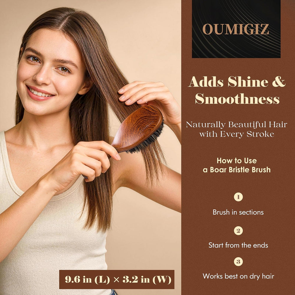 OUMIGIZ boar bristle brush detangling action in use for smoother hair.