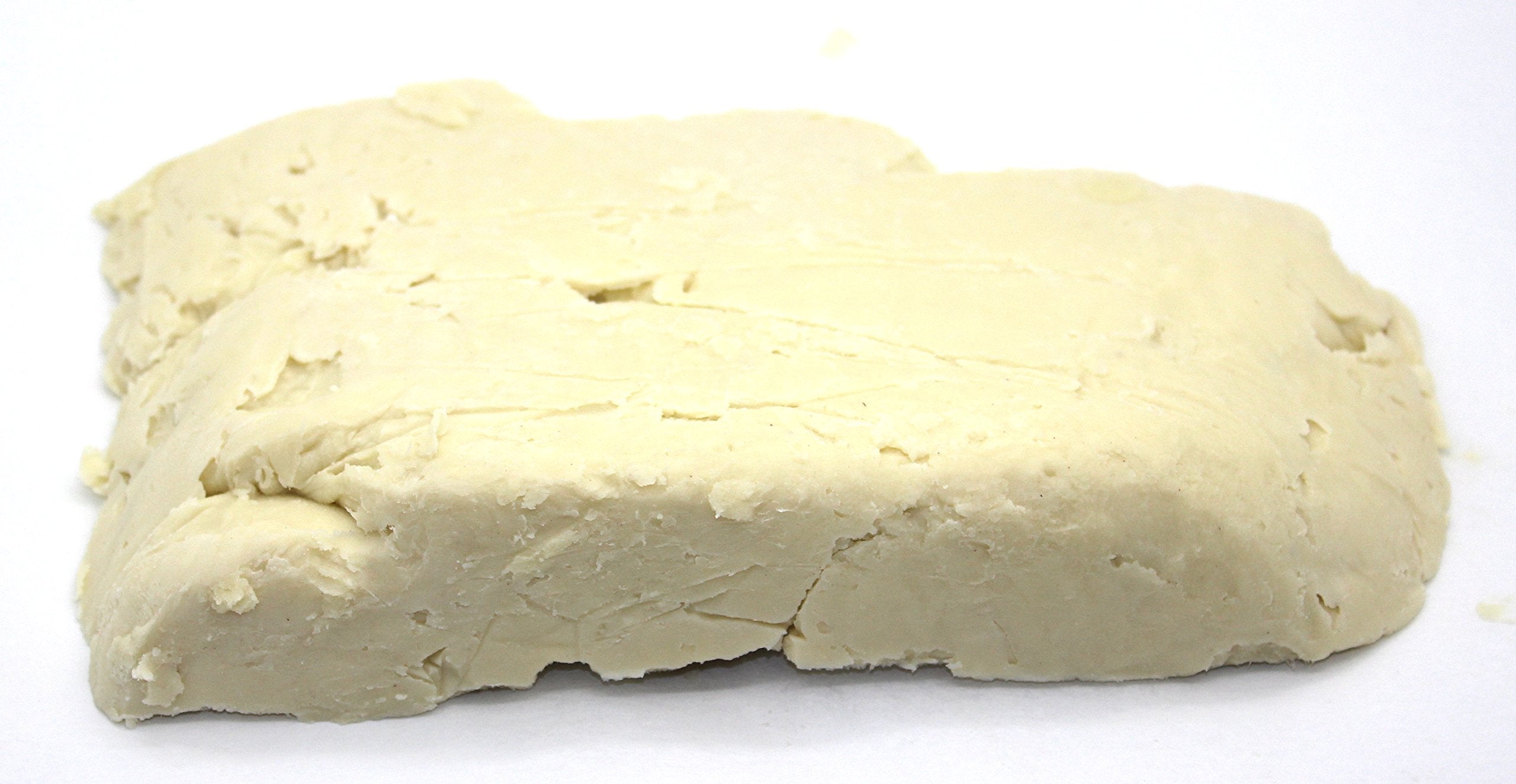 Our Earth's Secrets Manteca Karité Ivory textura crema, ideal para hidratación diaria.