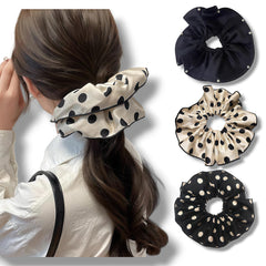 Oversized satin scrunchies black-and-white polka dots complete office-to-evening looks.