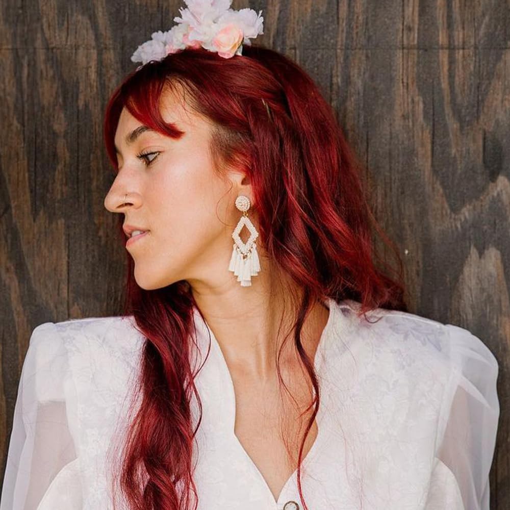 Overtone Ruby Red color-depositing mask shown on hair with shine payoff.