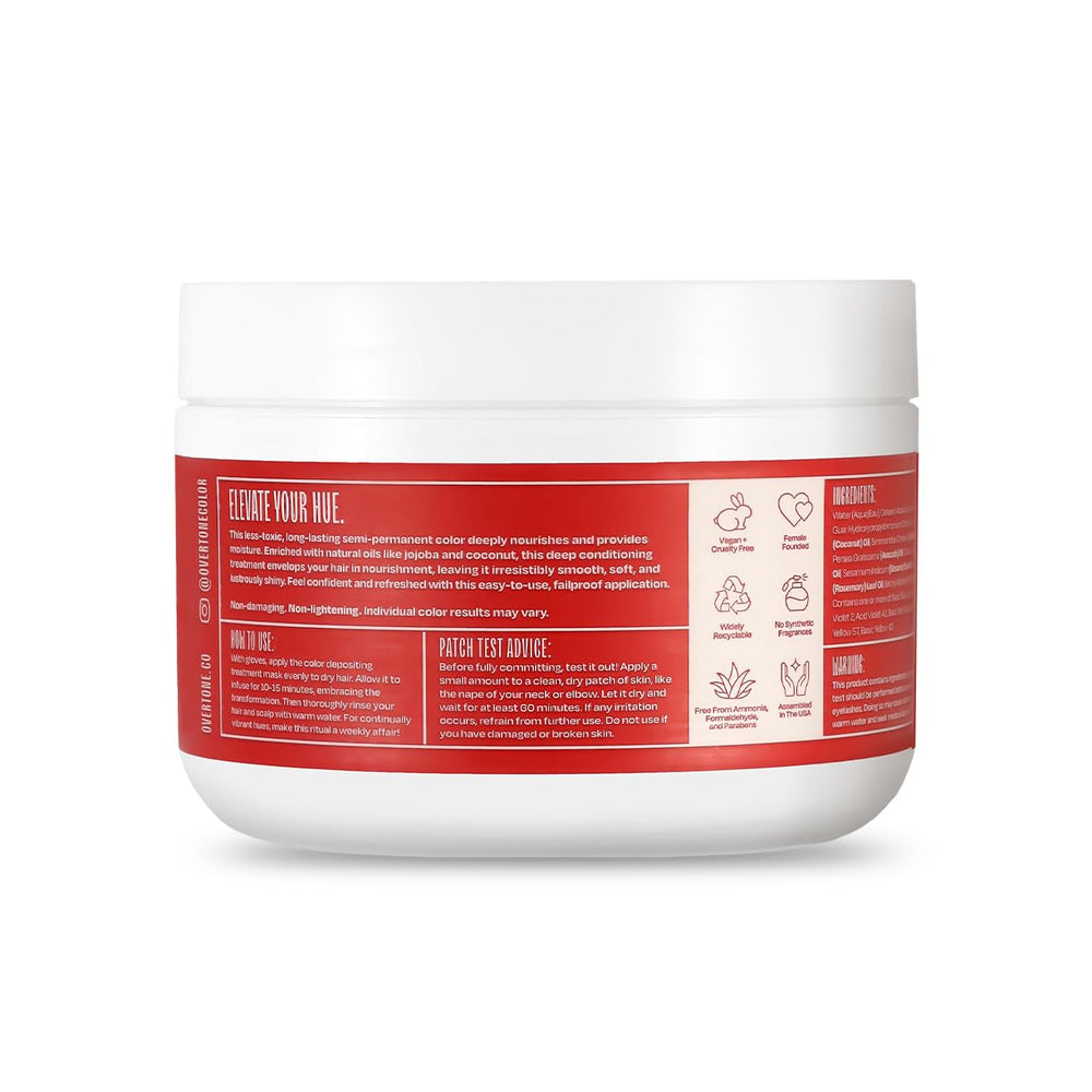 Overtone Ruby Red on head with visible color deposit on hair strand.