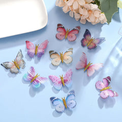 Paderison gold glitter body detail on butterfly clip catches light.