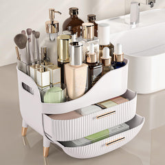 Pajiriona vanity storage on a dresser showing tall bottles fitting in the top compartment.