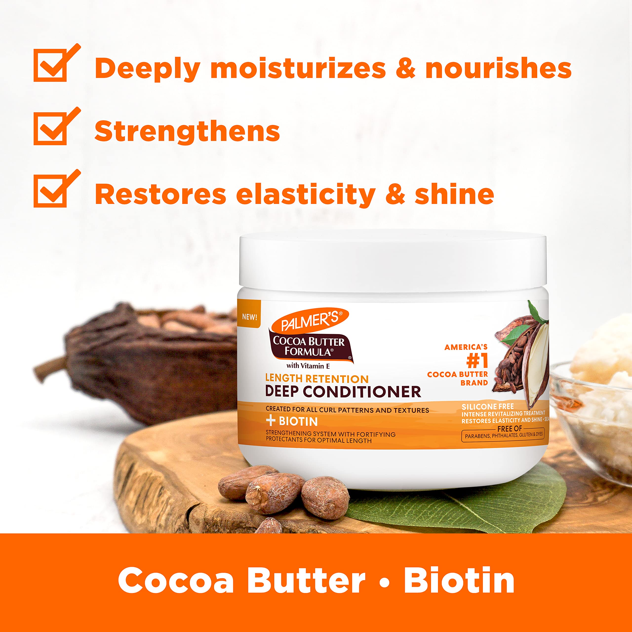 Palmer's cocoa butter biotin deep conditioner being applied for strong roots