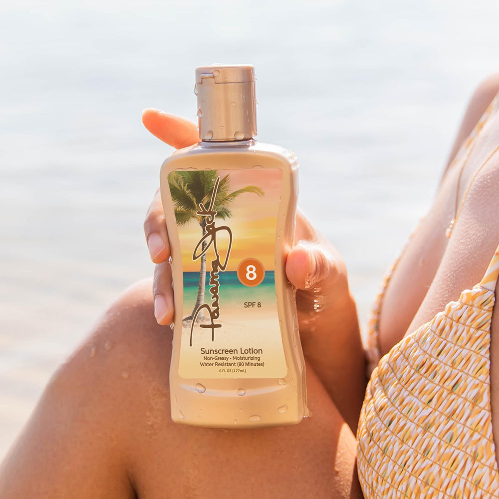 Panama Jack Sunscreen Tanning Lotion SPF 8 bottle in sunlit beach scene.