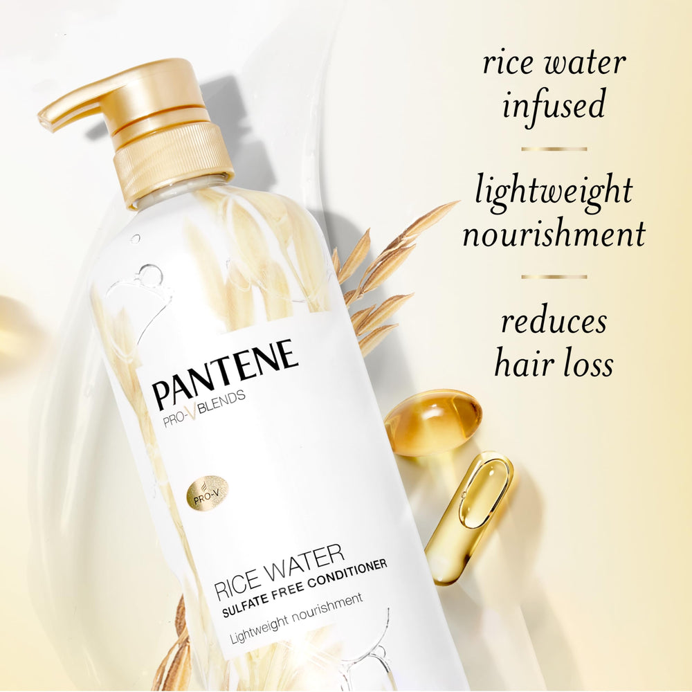 Pantene conditioner being applied to hair ends for smooth, manageable strands.