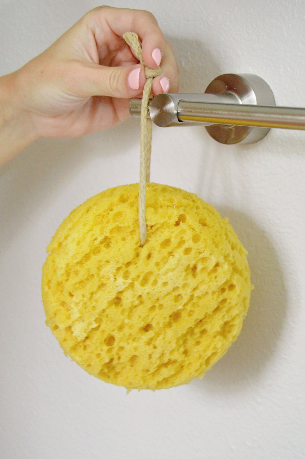 Paradiso Evriholder Sea Foam Sponge hanging by suction cup after bath