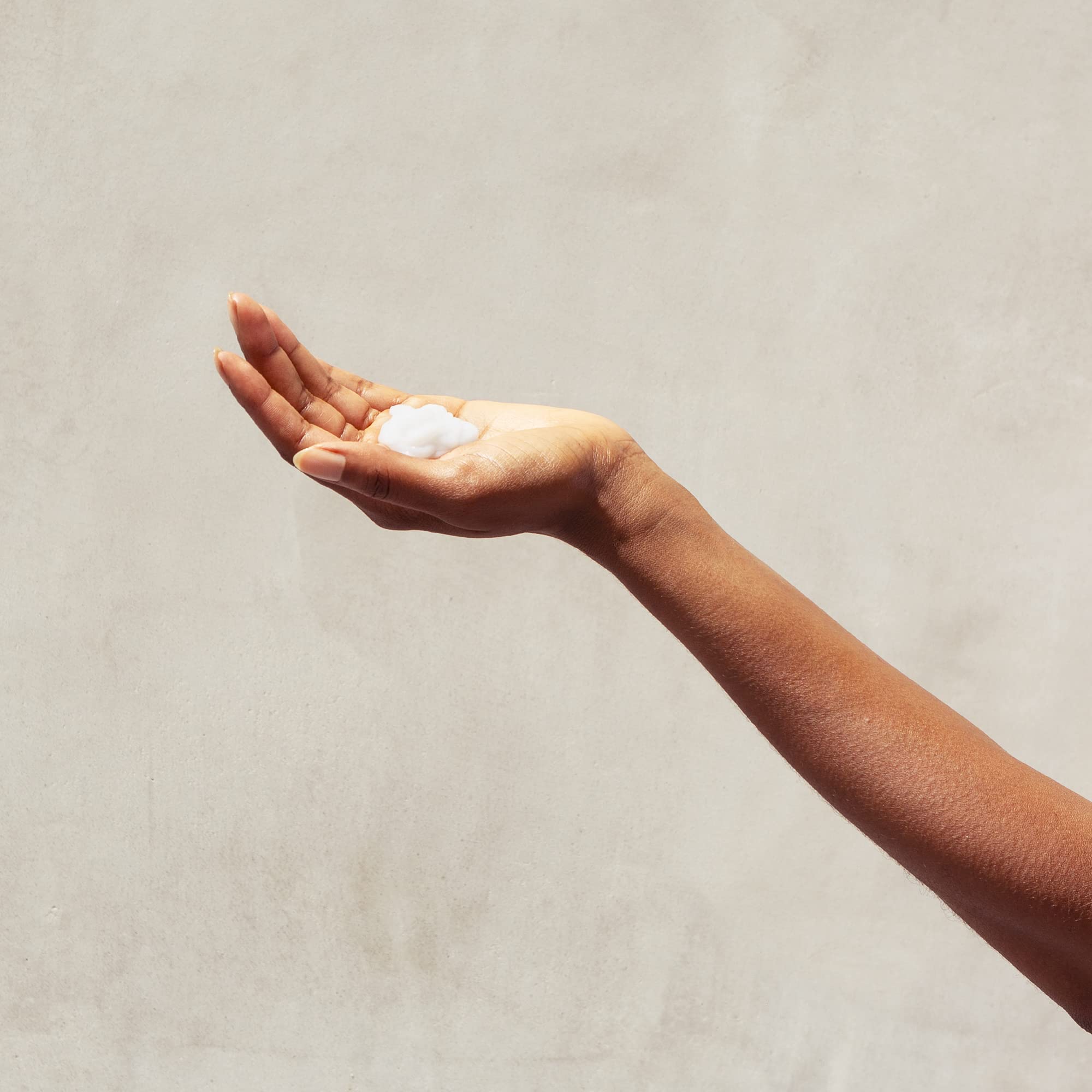 Biotin, aloe, and honey ingredients close-up in PATTERN Leave-In Conditioner.