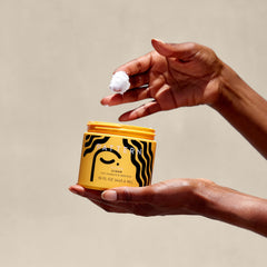 Twist-out with PATTERN Styling Cream yields defined, elongated coils.