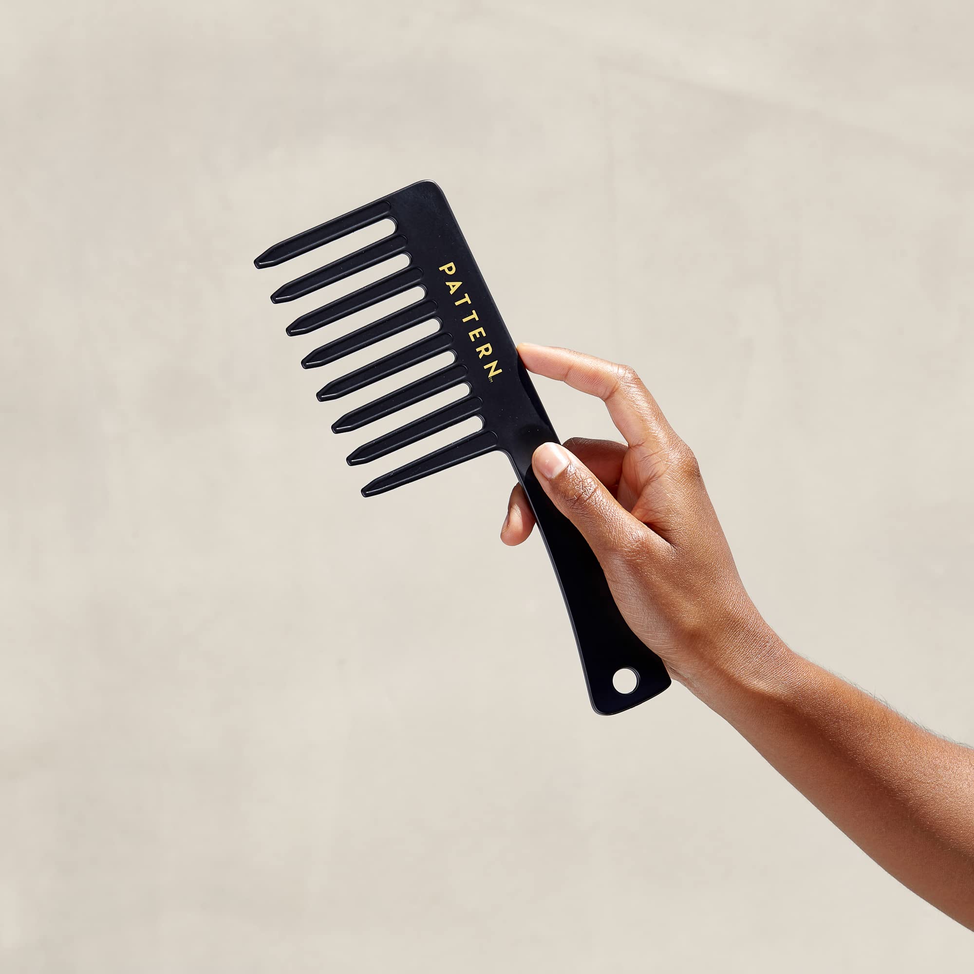 PATTERN Beauty wide tooth comb on dry hair boosts volume and separation.