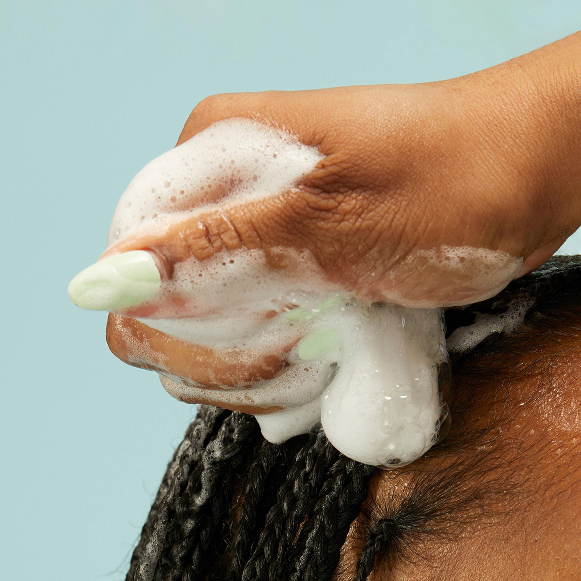 Curls gain shine and light lift without heaviness with PATTERN Mousse