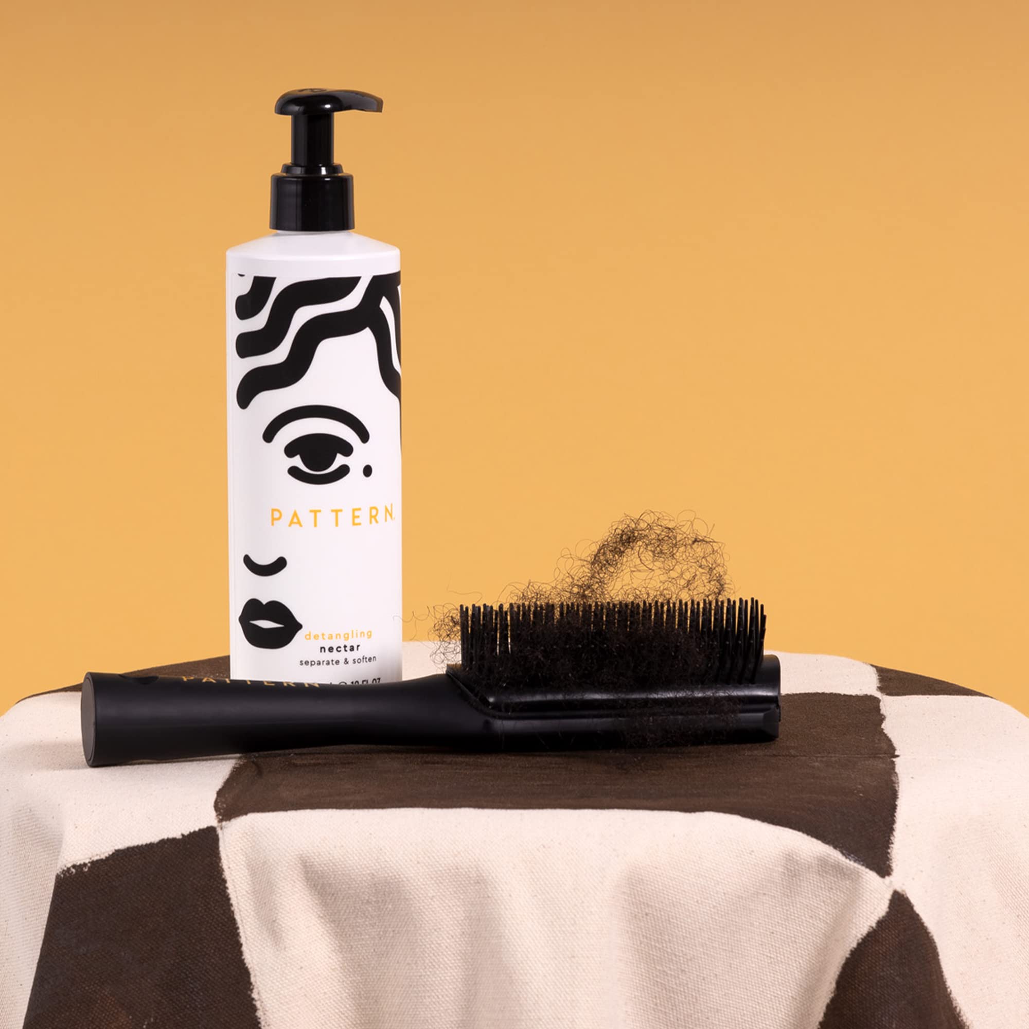 PATTERN Detangling Nectar on 3B-4C curls for better manageability.