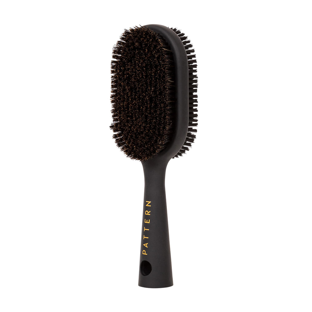 PATTERN double-sided boar bristle brush with firm side for sleek styles.