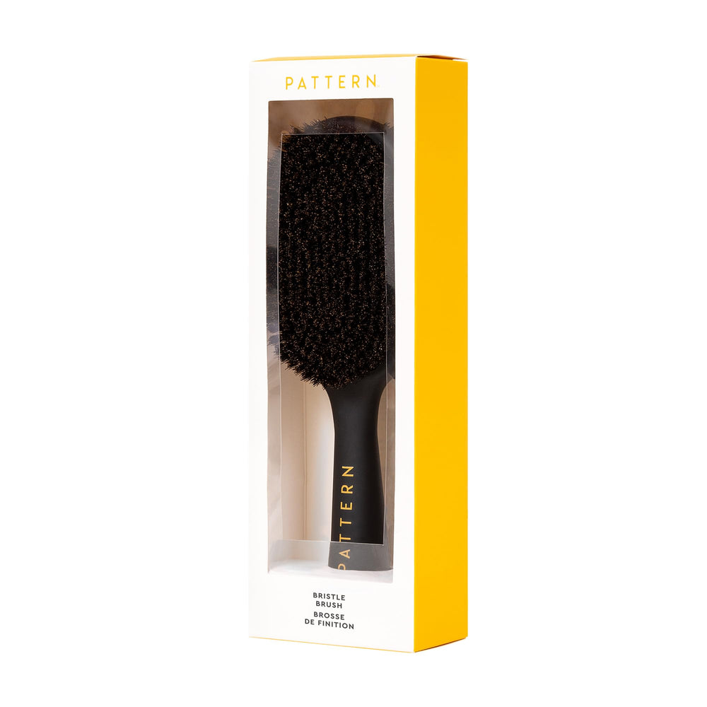 PATTERN soft bristle side to smooth curls and reduce frizz.