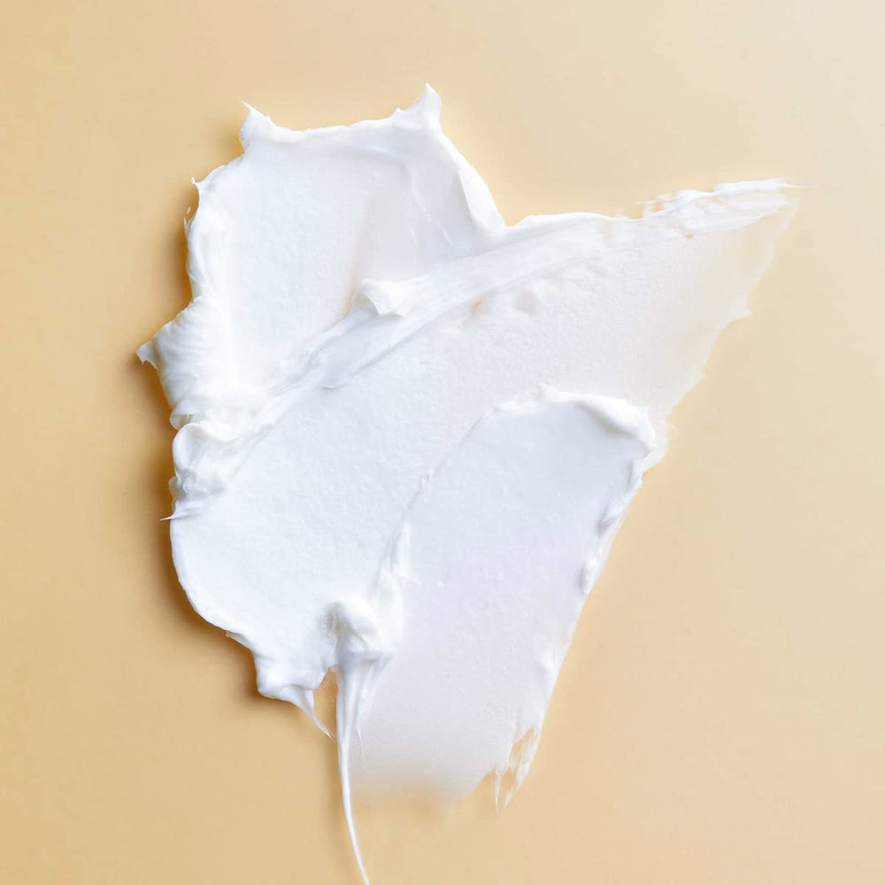 PATTERN Styling Cream texture swirls on fingers for moisture and elongation.