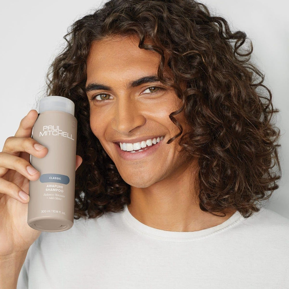 Paul Mitchell Awapuhi Shampoo bottle emphasizes color-safe care.
