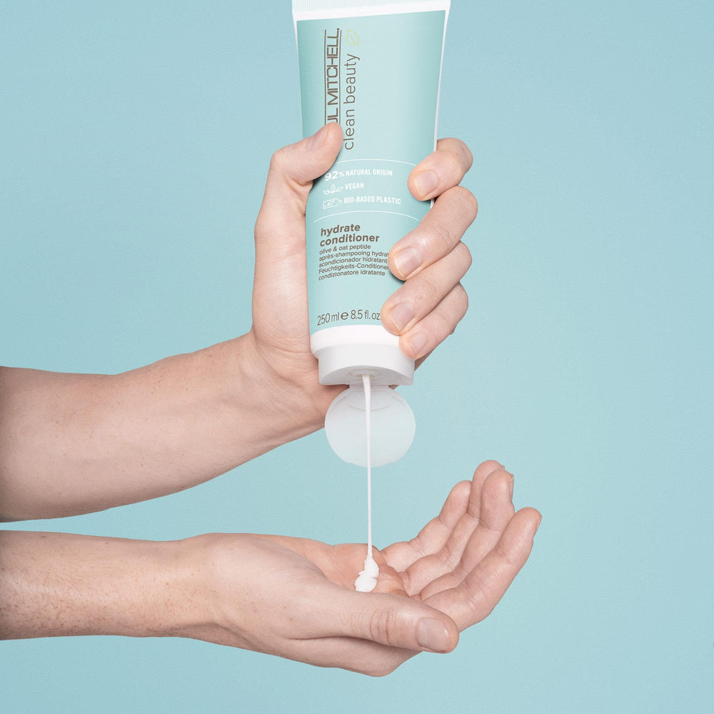 Paul Mitchell Hydrate Conditioner pump demonstrates easy, even application for nourished strands.