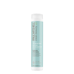 Paul Mitchell Clean Beauty Hydrate Shampoo bottle pour demonstrates hydration for dry hair.