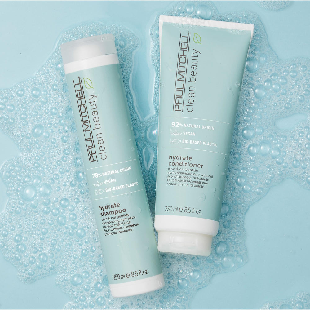 Paul Mitchell Clean Beauty Hydrate Shampoo close-up on dry hair for renewed moisture.