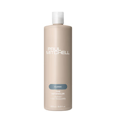 Paul Mitchell The Detangler botella cremosa facilita el desenredo y aporta brillo.