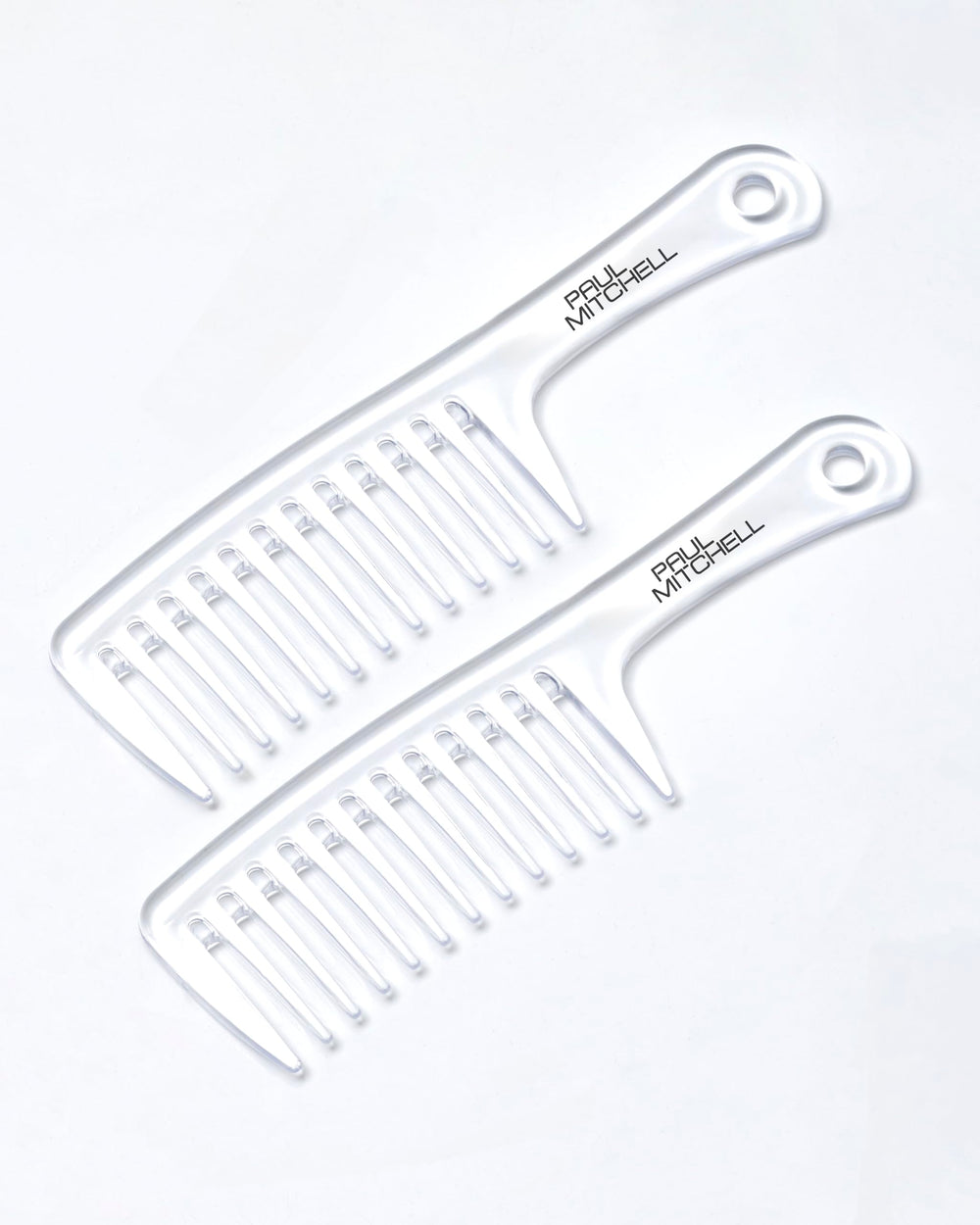 Paul Mitchell Detangler Comb on dry hair for snag-free styling.