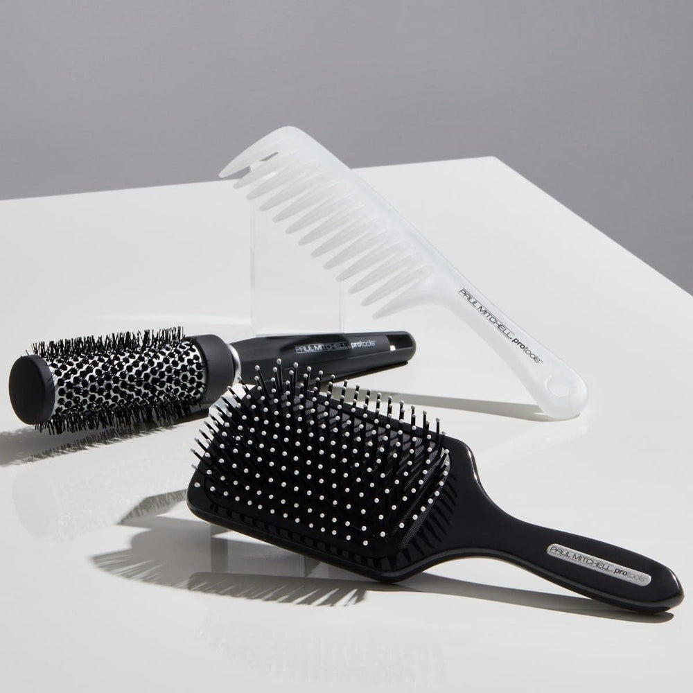 Detangler comb used to distribute leave-in conditioner evenly