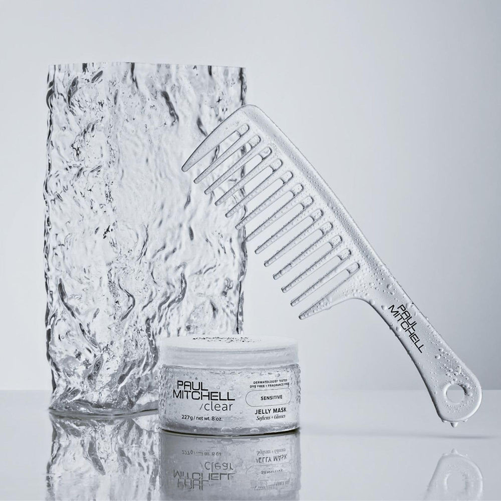 Paul Mitchell Detangler Comb close-up showing smooth teeth design.