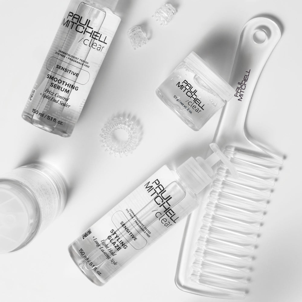 Paul Mitchell Detangler Comb distributing hair treatment evenly through damp strands.