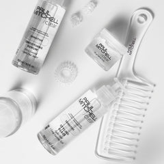 Paul Mitchell Detangler Comb distributing hair treatment evenly through damp strands.