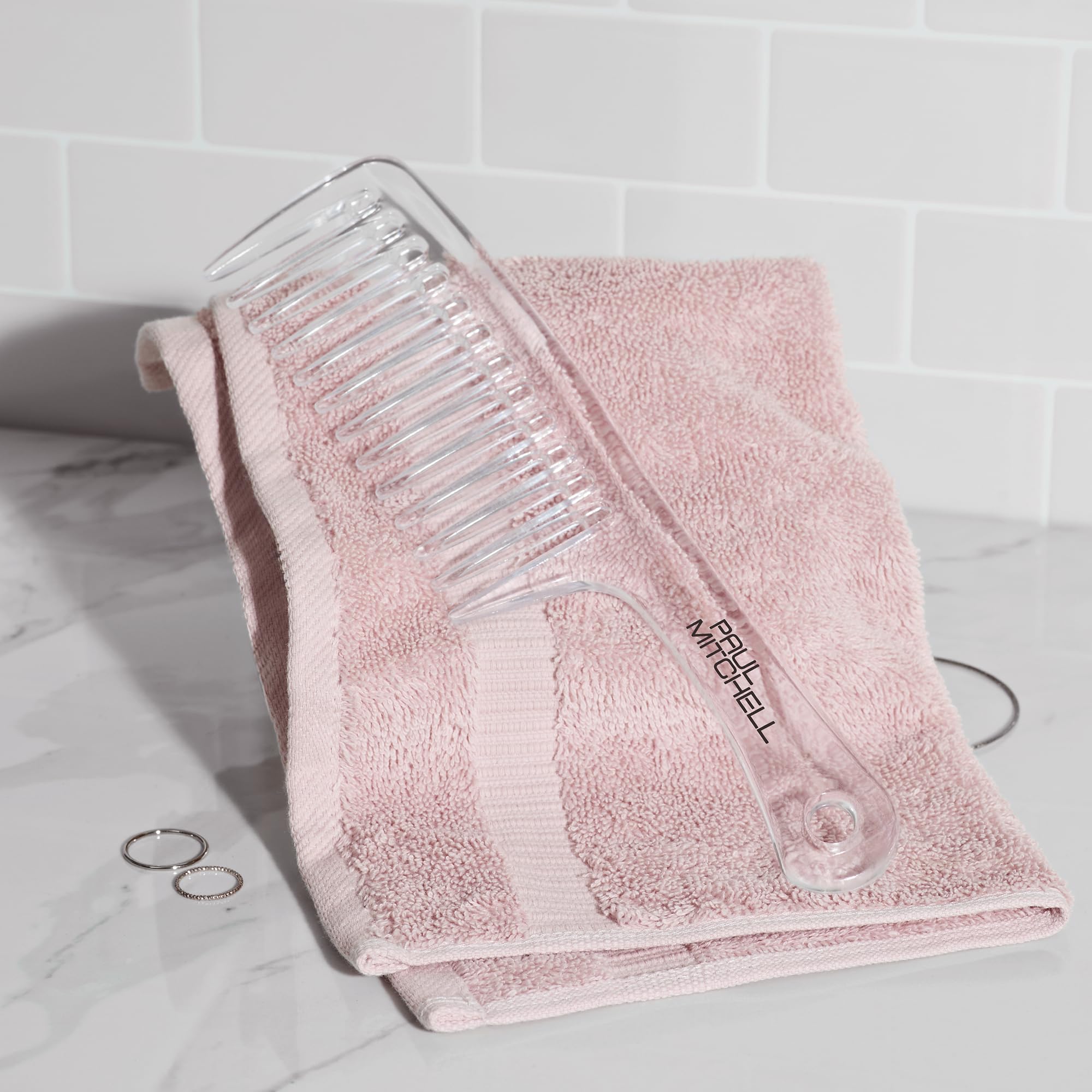 Paul Mitchell Detangler Comb used on wet hair for gentle detangling.