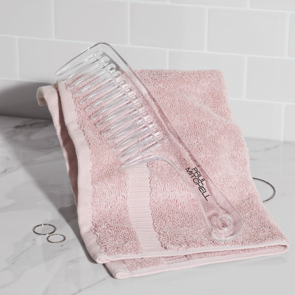 Paul Mitchell Detangler Comb used on wet hair for gentle detangling.