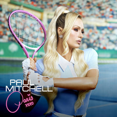 Applying Paul Mitchell Gloss Drops to damp hair as a primer for blowouts.