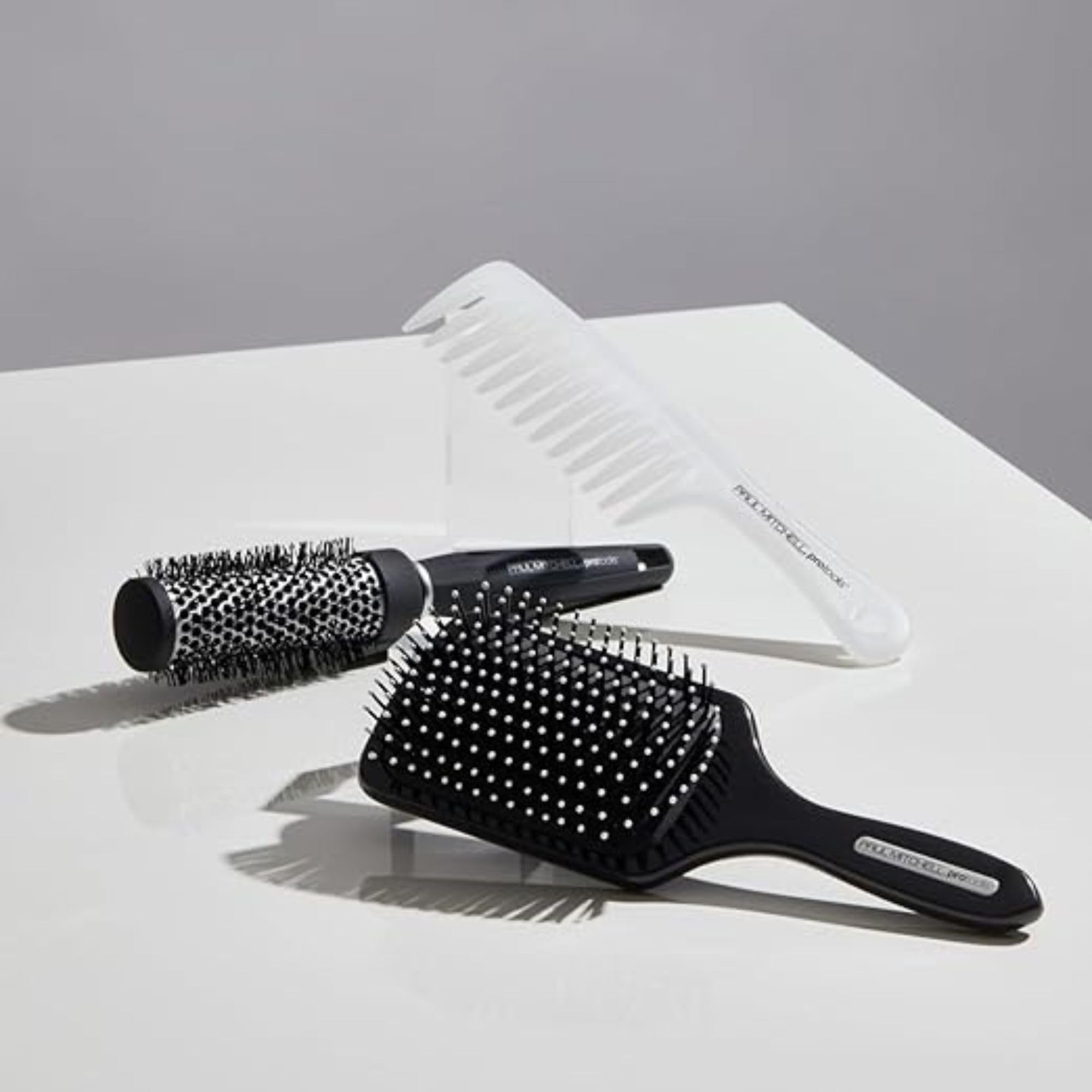 Paul Mitchell Pro Tools 427 Paddle Brush long hair use showing lift during styling